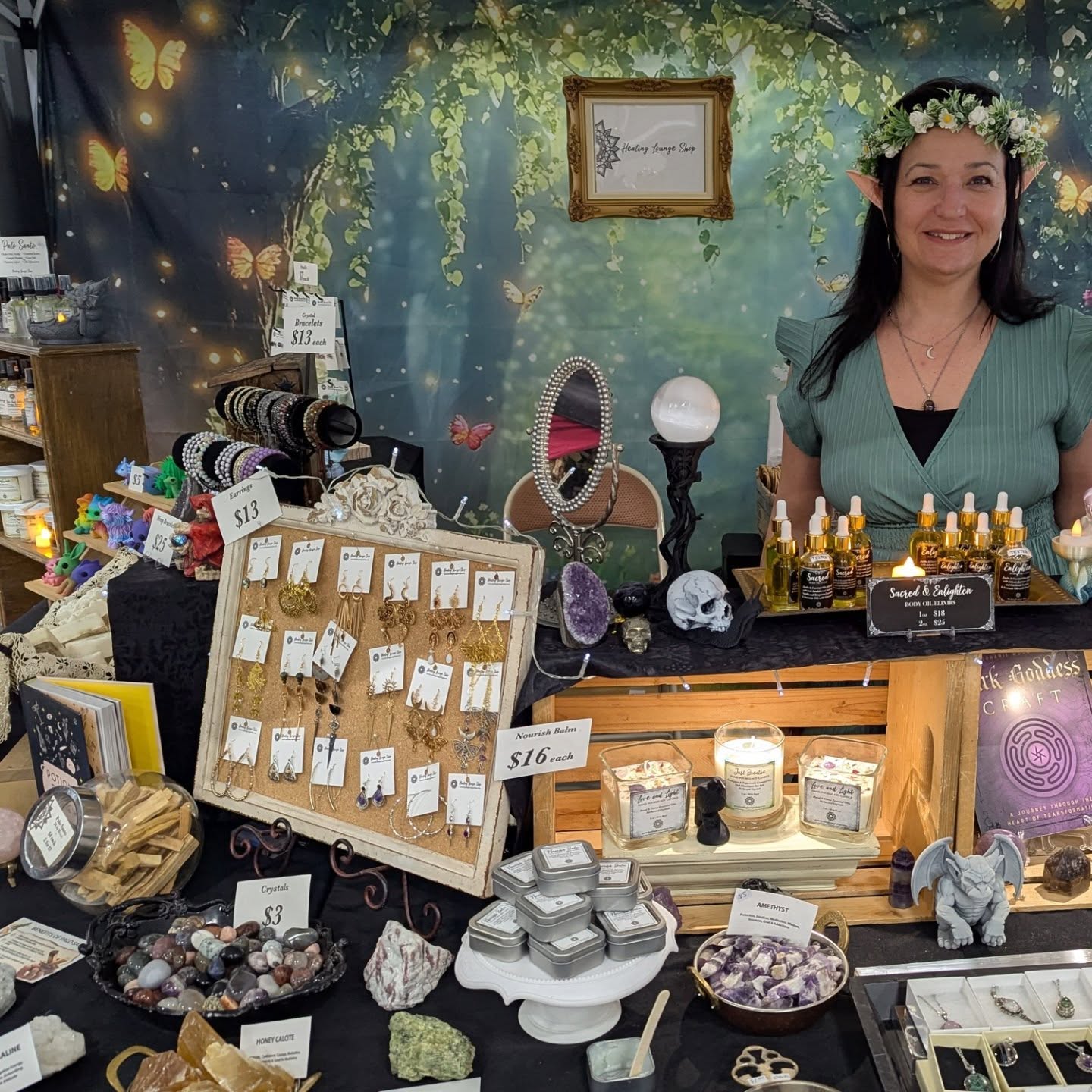 Booth display of crystals, oils, and jewelry, courtesy of The Healing Lounge Shop